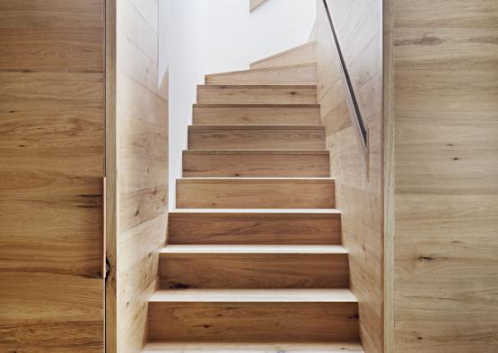 a wooden staircase with a doorway