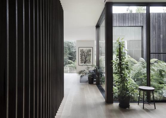 a room with a wood wall and a window