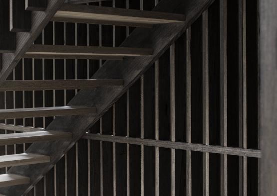 a wooden staircase with a wooden wall