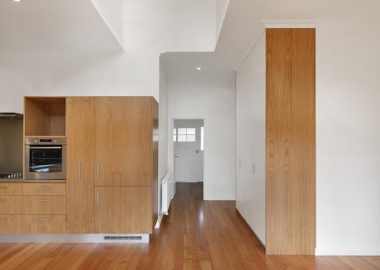 a room with wood cabinets and a wood floor