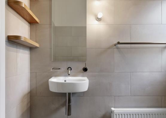 a bathroom with a mirror and a sink