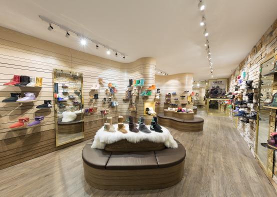 a shoe store with many shoes on display