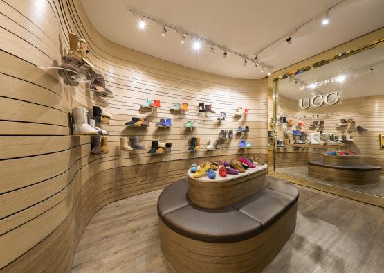 a shoe store with many shoes on display