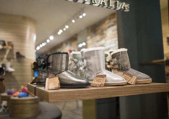a display of boots on a shelf