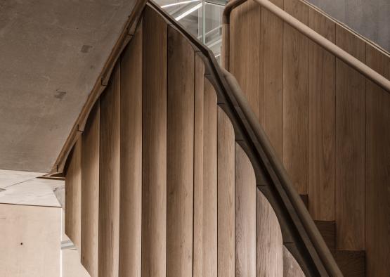 a wooden staircase with a handrail