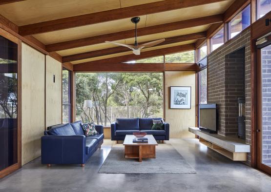 a living room with a fireplace and couches