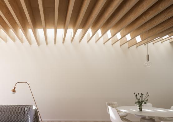 a room with a white wall and a table and chairs