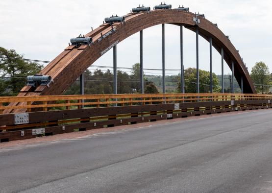 a wooden bridge with cars on it