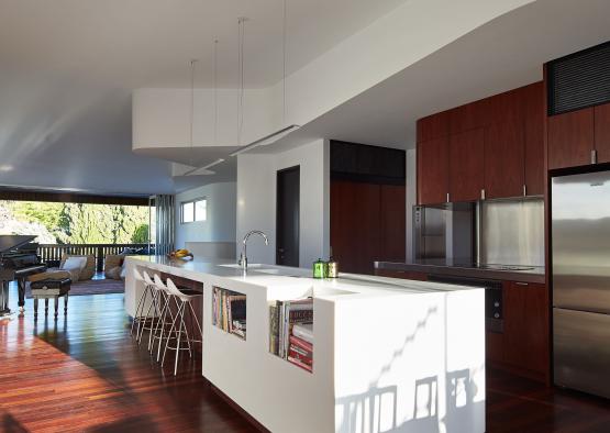 a kitchen with a wood floor and a table