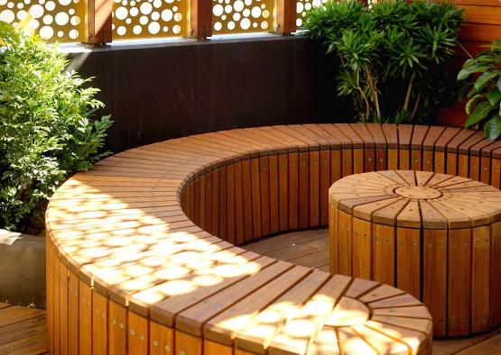 a wooden bench on a deck