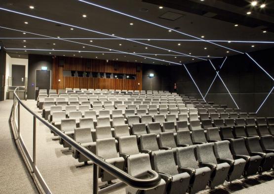 a large auditorium with rows of chairs