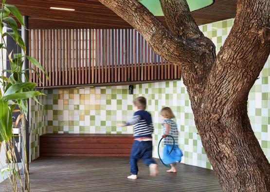 a children running under a tree