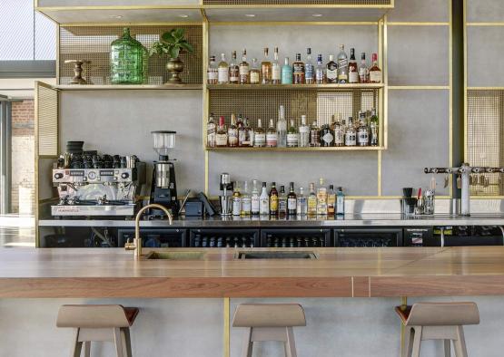 a bar with a counter and bar stools