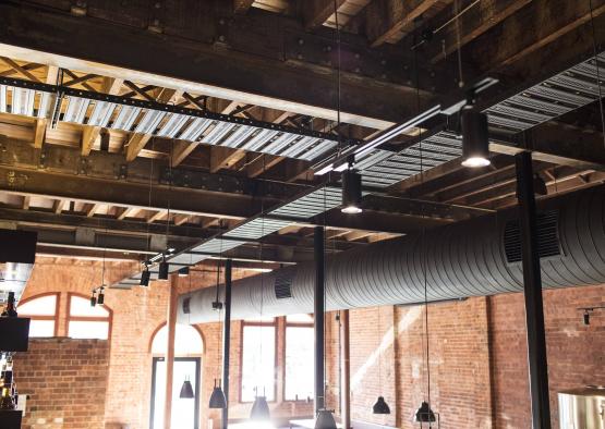 a ceiling with a pipe and lights