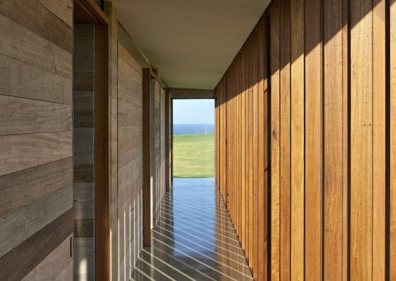 a long hallway with wood panels