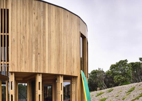 a round building with a surfboard in front of it