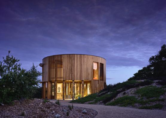 a circular building with a path leading to it