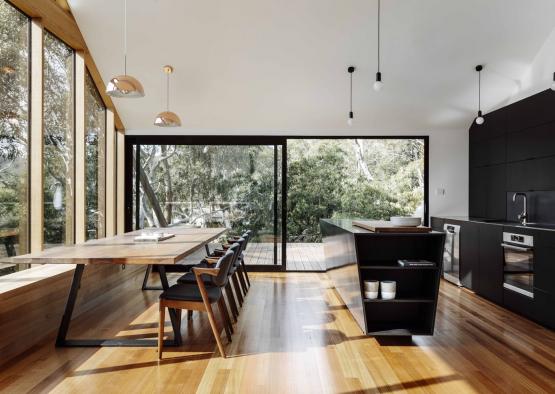 a dining room with a table and chairs