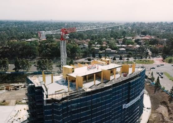 a tall crane over a building