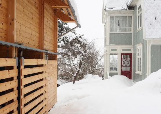 a snow covered ground outside of a house