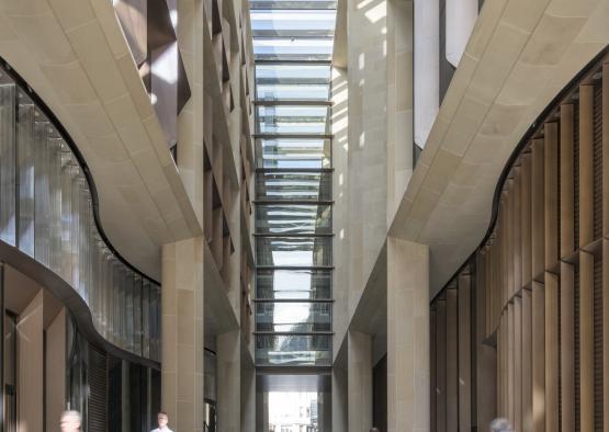 a group of people walking in a building