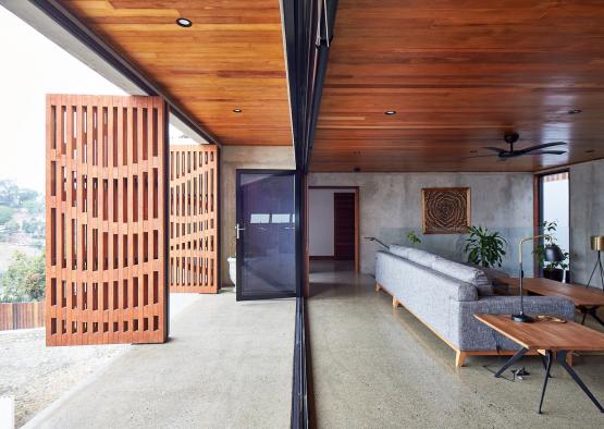 a room with a wood ceiling and a couch
