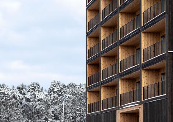 a building with balconies and snow
