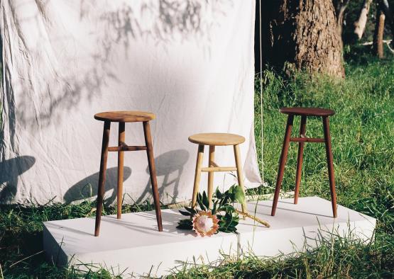 a group of stools on a white surface