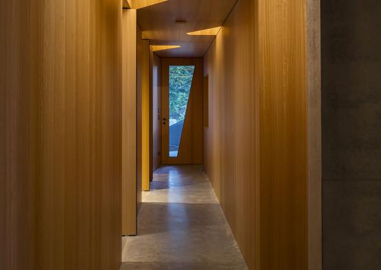 a hallway with wooden walls and lights