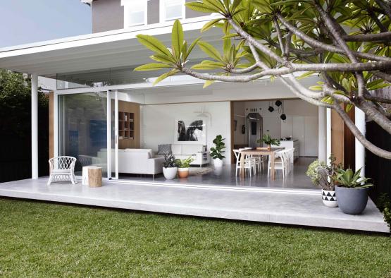 a house with a patio and a glass door