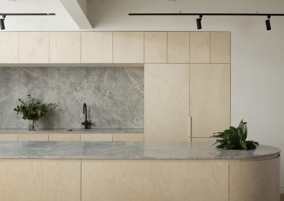 a kitchen with a marble countertop