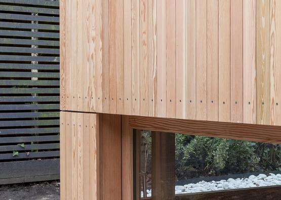 a wooden building with a glass window