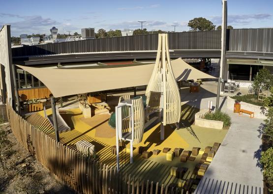 a playground with a wooden structure