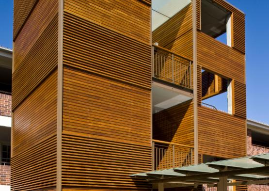 a wood building with a balcony