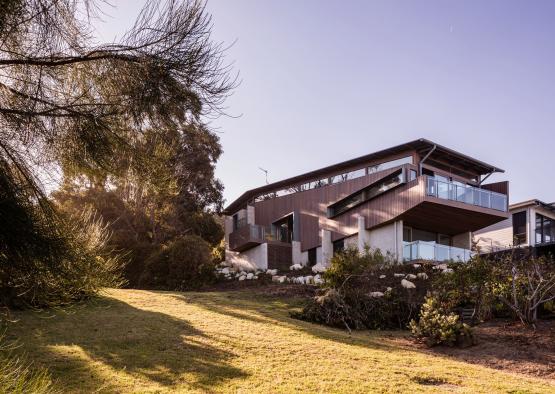 a house with a lawn and trees