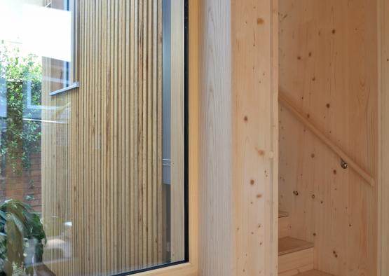 a wooden staircase and a window