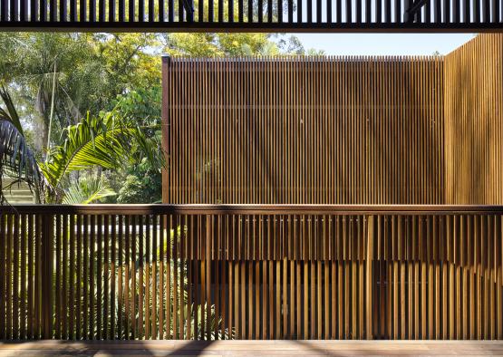 a wood wall with a railing