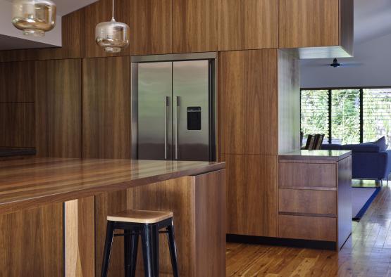 a kitchen with a stainless steel refrigerator