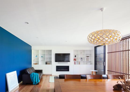 a living room with a table and a tv