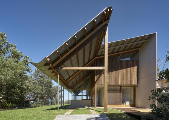 a building with a roof over a porch