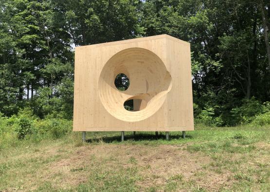 a wooden square with a hole in it