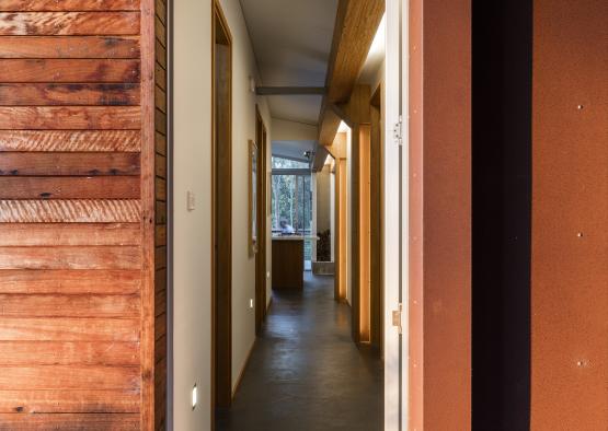 a hallway with wood walls and a wood wall