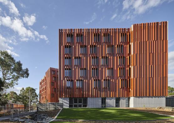 a building with a fence and grass