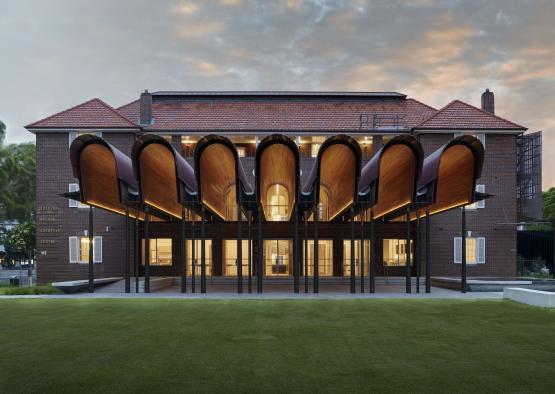 a building with a green lawn