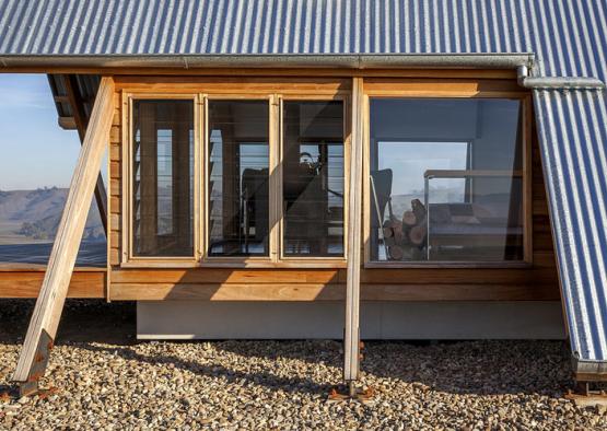 a wooden building with windows