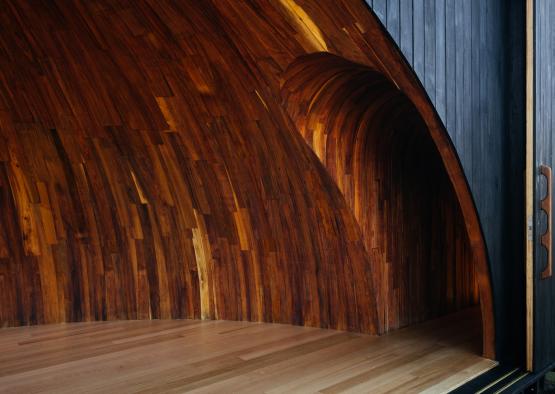a wooden wall with a curved arch