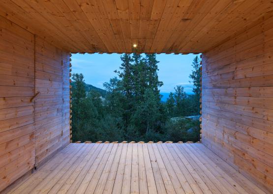 a room with a view of trees and mountains