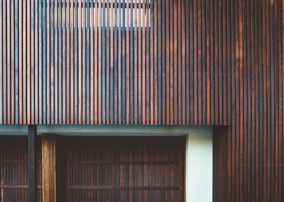 a wood wall with a garage door