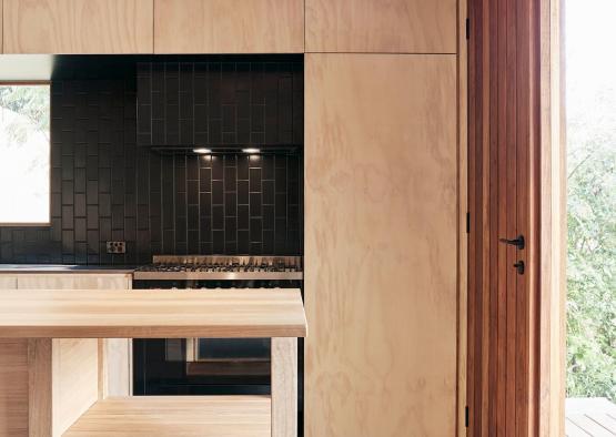 a kitchen with a wood paneling