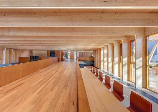 a room with a long table and chairs